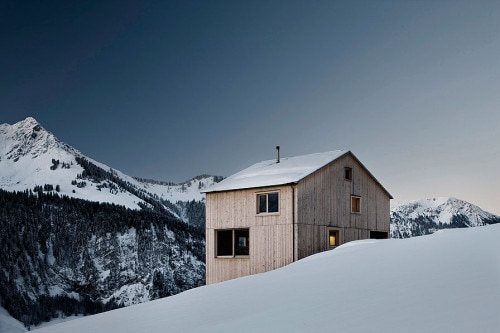 Fontanella House is a minimalist house located in Fontanella, Austria, designed by Bernardo Bader. Not far from the center of the Walser village Fontanella in the Great Walser Valley, the house stands as a solitary volume on an inclined south-facing terrace. In order to both benefit from the wonderful views and limit the intervention of the property to the land, the house was well placed at the upper limit of the lot and tried to make the volume of the house as compact as possible. The outer skin of the entire building is made ​​of local pine boards in different widths. (2)