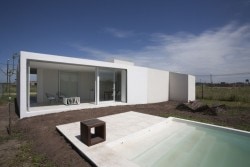 Cisura House is a minimalist house located in Roldán, Argentina, designed by Manuel Cucurell + Sebastián Virasoro. The building is located in an rapidly developing area currently in the process of transformation. The development focuses on providing safety, while also responding to privacy and environmental transitions as well. (3)