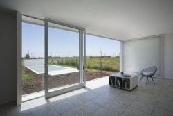 Cisura House is a minimalist house located in Roldán, Argentina, designed by Manuel Cucurell + Sebastián Virasoro. The building is located in an rapidly developing area currently in the process of transformation. The development focuses on providing safety, while also responding to privacy and environmental transitions as well. (4)