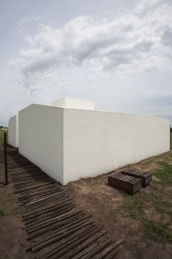 Cisura House is a minimalist house located in Roldán, Argentina, designed by Manuel Cucurell + Sebastián Virasoro. The building is located in an rapidly developing area currently in the process of transformation. The development focuses on providing safety, while also responding to privacy and environmental transitions as well. (5)