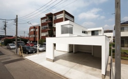 House of Takasaki is a minimalist house located in Gunma, Japan, designed by studio LOOP Architects. The two-family home is located in a quiet residential neighborhood near the Takasaki City Hall. In order to ensure privacy and maximize the site, the home is configured in an L-shape. The living space opens up to the courtyard through a series of sliding doors. (1)