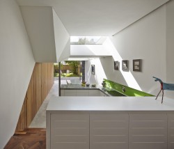 Islington House is a minimalist house located in London, England, designed by Neil Dusheiko Architects. The interior of the existing ground floor has been completely gutted and re-imagined as a sequence of spaces connecting living, kitchen and dining through changes in section. The kitchen forms the fulcrum and heart of the house with views to the living room on the upper level and to the dining room on the lower level, which also connects to the garden. (1)