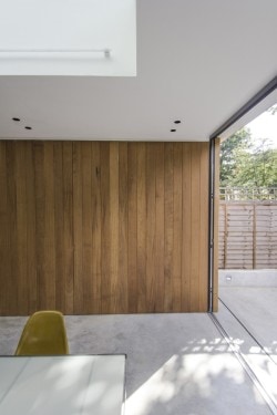 Islington House is a minimalist house located in London, England, designed by Neil Dusheiko Architects. The interior of the existing ground floor has been completely gutted and re-imagined as a sequence of spaces connecting living, kitchen and dining through changes in section. The kitchen forms the fulcrum and heart of the house with views to the living room on the upper level and to the dining room on the lower level, which also connects to the garden. (7)