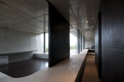 Banna House is a minimalist design created by Japan-based designer Noriyoshi Morimura Architect & Associates. The concrete structure is characterized by its unique angular architecture. Appearing almost as a pavilion of sorts, panoramic windows span the length of the building to provide views of the mountain landscape. The interior is also constructed of the exposed concrete, and is juxtaposed against black walls. (12)