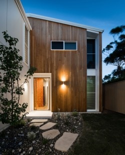 Cooks Hill Residence is a minimalist house located in Newcastle, Australia, designed by Bourne Blue Architecture. The building is located in a warm-climate region, and thus includes expansive windows that slide open to allow for the dining area to open up to the outside. The exterior is composed of wooden panels which coalesce with the patio and interior flooring. (13)