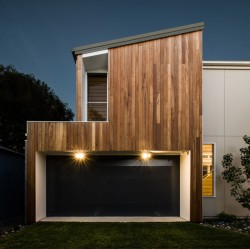 Cooks Hill Residence is a minimalist house located in Newcastle, Australia, designed by Bourne Blue Architecture. The building is located in a warm-climate region, and thus includes expansive windows that slide open to allow for the dining area to open up to the outside. The exterior is composed of wooden panels which coalesce with the patio and interior flooring. (14)