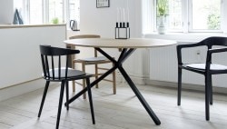 Frisbee is a minimalist design created by Denmark-based designer Herman CPH. The collection includes a dining table, and a set of side and coffee tables. The round dining table is suitable for three to six people, and is made of oiled oak. The frame is black powder-coated metal, with small oak feet. Frisbee coffee and side tables are available in three sizes. The tables works together as a whole or separately. (10)