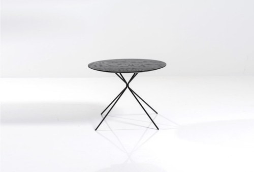 Frisbee is a minimalist design created by Denmark-based designer Herman CPH. The collection includes a dining table, and a set of side and coffee tables. The round dining table is suitable for three to six people, and is made of oiled oak. The frame is black powder-coated metal, with small oak feet. Frisbee coffee and side tables are available in three sizes. The tables works together as a whole or separately. (4)