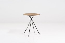 Frisbee is a minimalist design created by Denmark-based designer Herman CPH. The collection includes a dining table, and a set of side and coffee tables. The round dining table is suitable for three to six people, and is made of oiled oak. The frame is black powder-coated metal, with small oak feet. Frisbee coffee and side tables are available in three sizes. The tables works together as a whole or separately. (6)