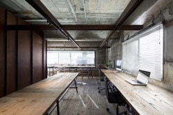 Suppose Tokyo Office is a minimalist interior located in Tokyo, Japan, designed by Suppose Design Office. The space is comprised of industrialized materials such as old scaffold board for the flooring, and an exposed concrete wall. (1)