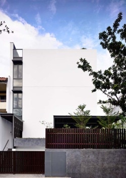Vertical Court is a minimalist house located in Park, Singapore, designed by HYLA Architects. The project consists of a courtyard on two levels sitting in the center of this semi-detached house. (1)