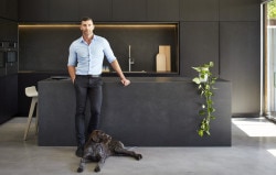 M House is a minimalist house located in Melbourne, Australia, designed by DKO. The kitchen space features blacked out custom cabinetry with a black kitchen island that allows for seating and serving. (1)