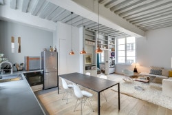 Garçonnière Marais is a minimalist house located in Paris, France, designed by Tatiana Nicol. The 50 sqm apartment features exposed ceiling beams and a custom partition with built in storage and shelving space. (1)